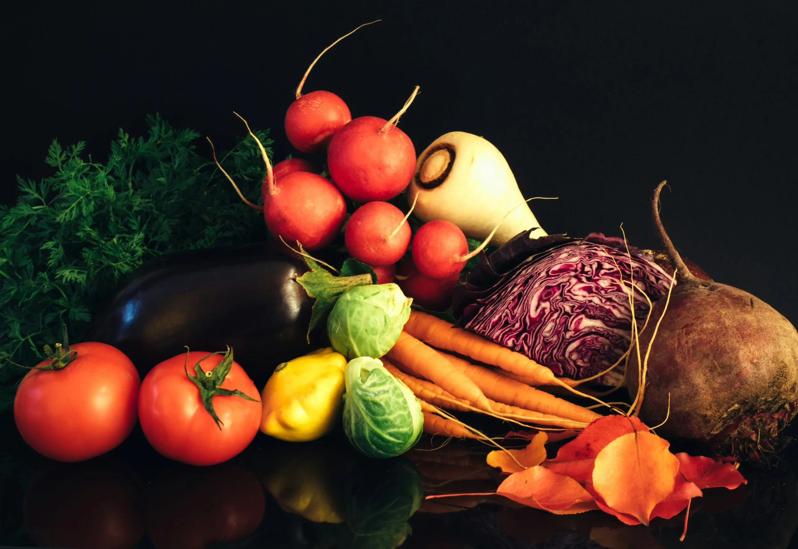 Assorted fresh vegetables arranged on a table with vibrant colors and variety