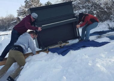 web2016012795143841 huge piano being moved across snow in bountiful utah